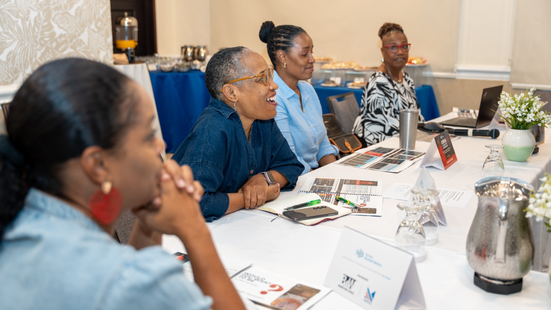 Executive attendees engaged in group discussion